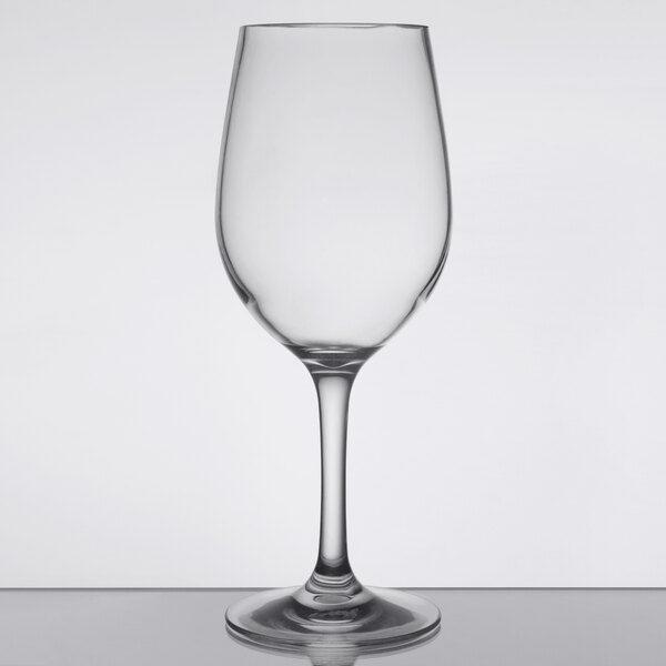 A clear 12 oz. plastic wine glass with a stem and rounded bowl.