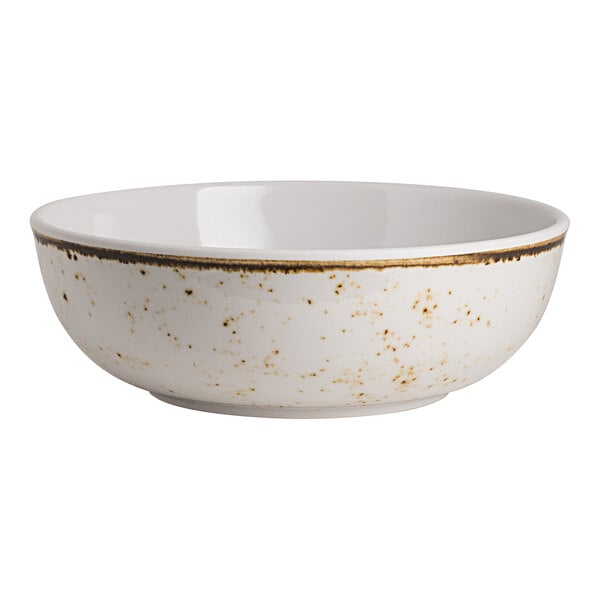 A white round bowl with a speckled pattern and a brown rim.