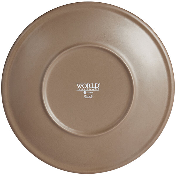 A round, sand-colored matte porcelain coupe plate with a smooth finish.