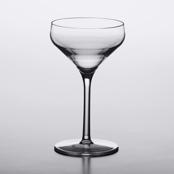 A clear 8 oz. plastic coupe glass with a wide bowl and a short stem.
