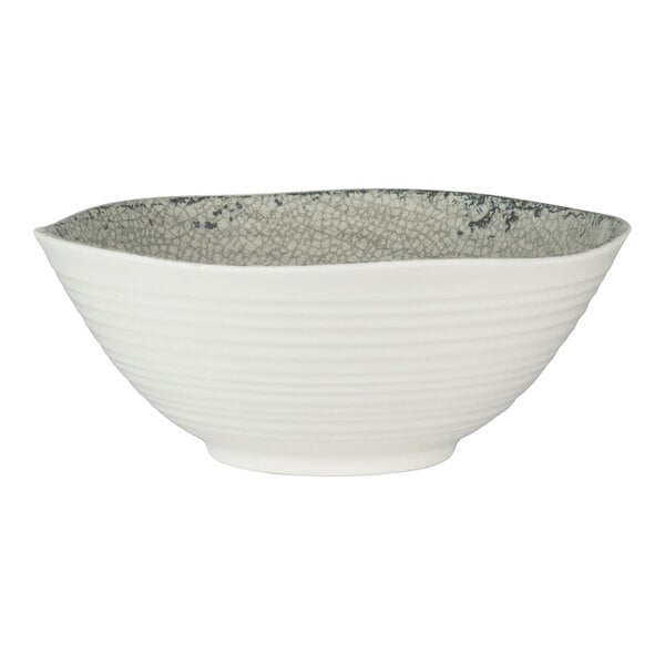 A small round white melamine bowl with a textured gray interior.