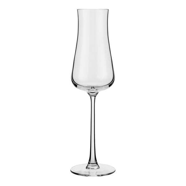 A clear, tall flute glass with a long stem and a narrow bowl.