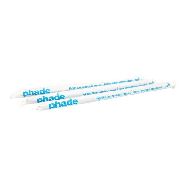 A pair of individually wrapped blue compostable straws labeled 'phade.'