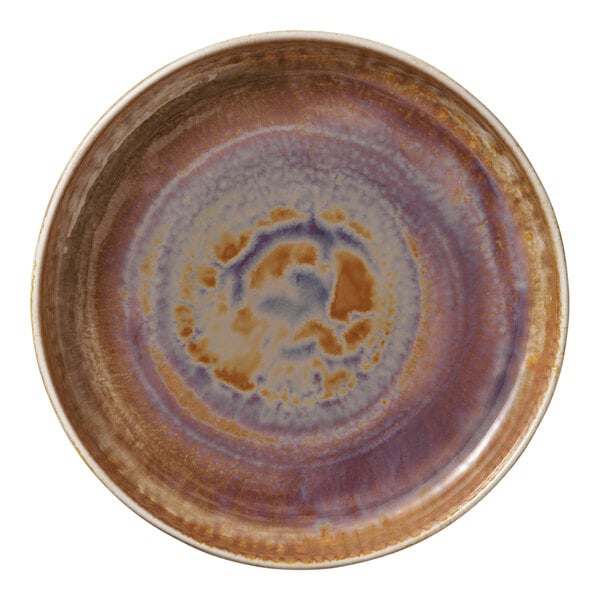 A round porcelain plate with a deep raised rim and a multicolored glaze featuring shades of brown, purple, and blue.