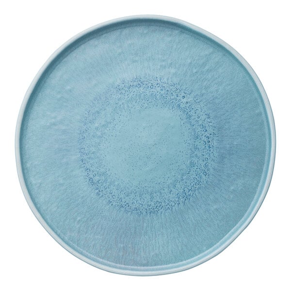 A round, blue melamine plate with a textured design.