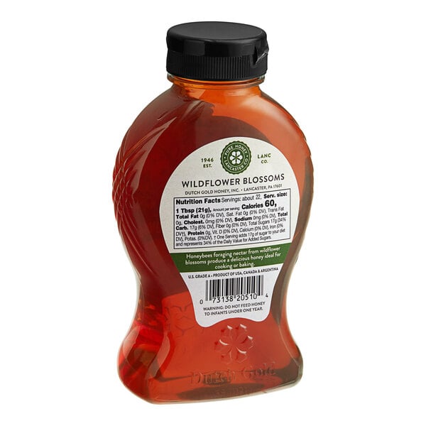 A bottle of Dutch Gold Wildflower Honey with a label.