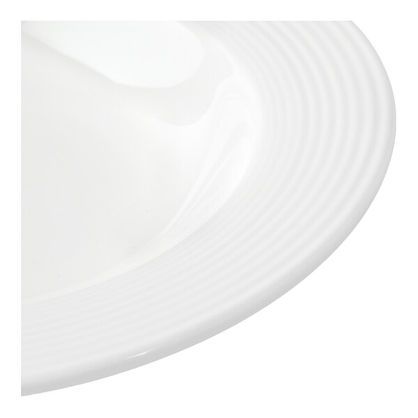 A white porcelain soup bowl with a ridged rim design.
