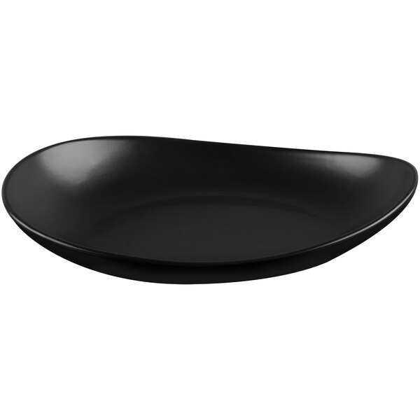A black, matte, organically shaped porcelain coupe plate.