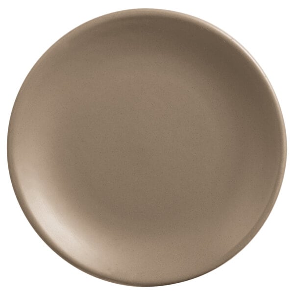 A round, sand-colored satin matte porcelain coupe plate.