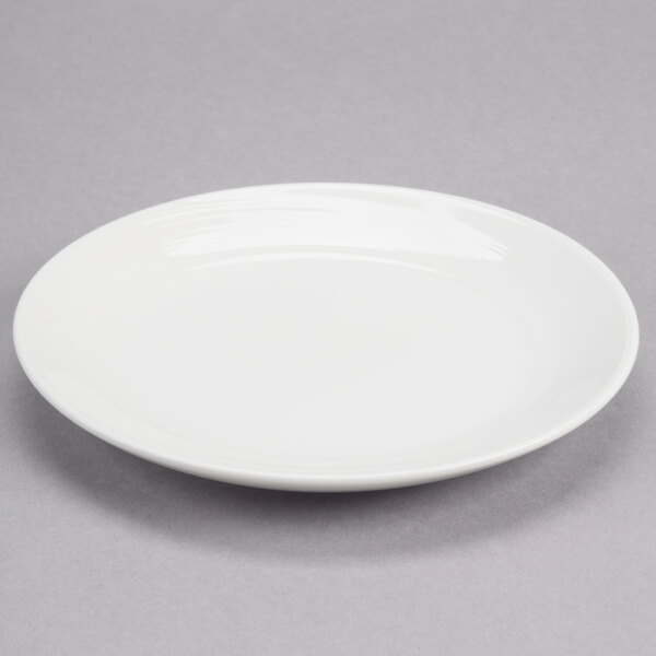 A round white porcelain coupe plate.