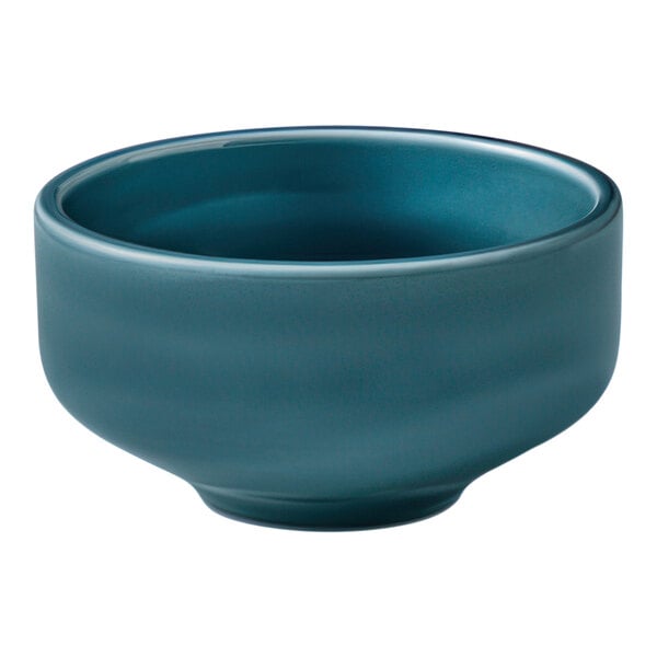 A petrol blue porcelain coupe bowl with an 11.9 oz. capacity.
