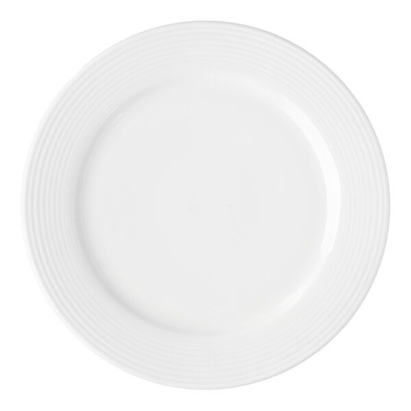 A round white porcelain plate with a subtle ridged pattern along the rim.