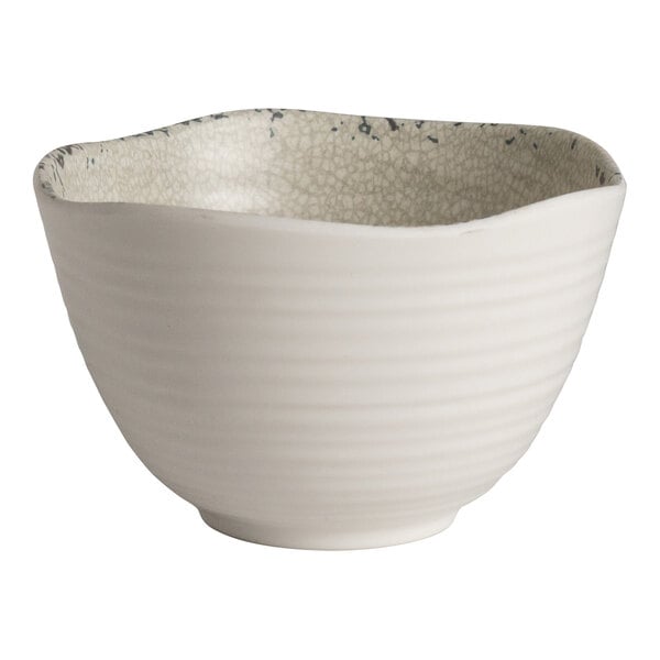 A 9 oz. round stone melamine bowl with a textured interior and smooth exterior.