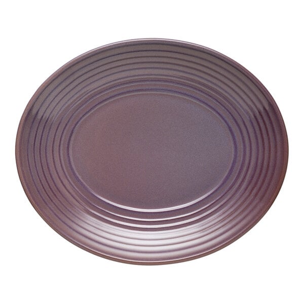 A mauve oval terracotta platter with a ridged design around the edge.