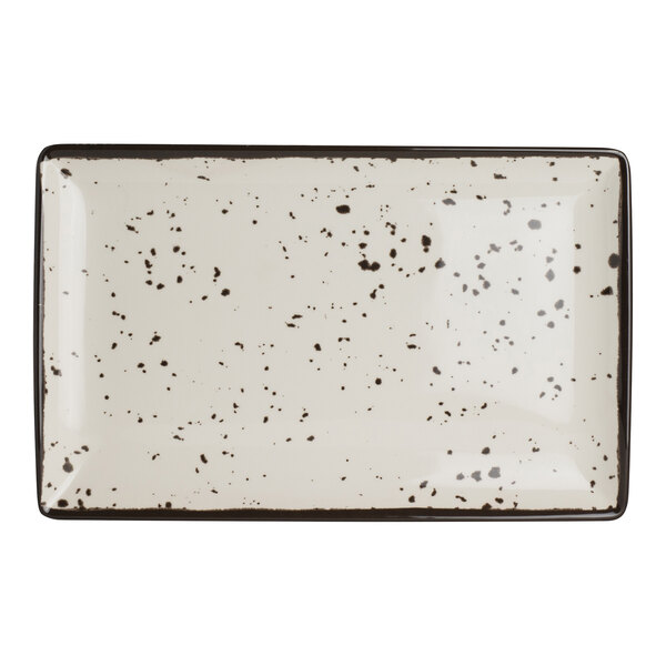 A rectangular white melamine tray with black speckled pattern and a dark border.