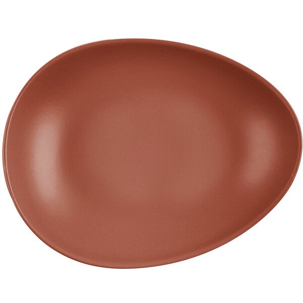 An oval-shaped, clay-colored satin matte porcelain coupe plate.