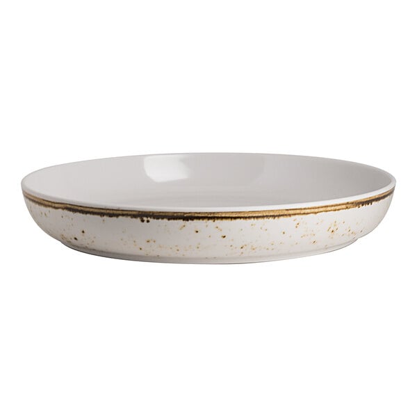 A white round bowl with a rustic brown speckled rim and exterior.