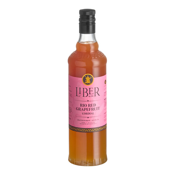 A 750 mL bottle of Liber & Co Rio Red Grapefruit Cordial Syrup with a pink label.