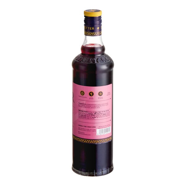 A 750 mL bottle of Liber & Co Real Grenadine Syrup with a pink label and yellow cap.