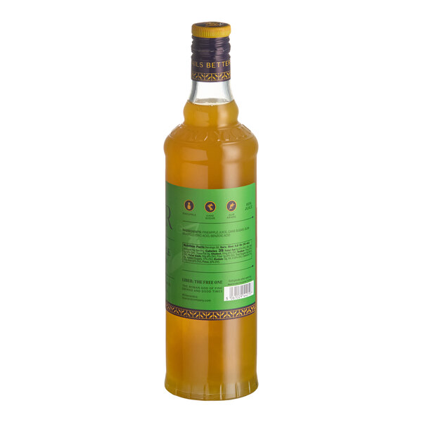 A 750 mL bottle of Liber & Co Pineapple Gum Syrup with a green label.