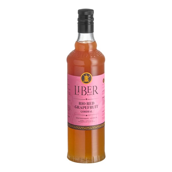 A 750 mL bottle of Liber & Co Rio Red Grapefruit Cordial Syrup with a pink label.