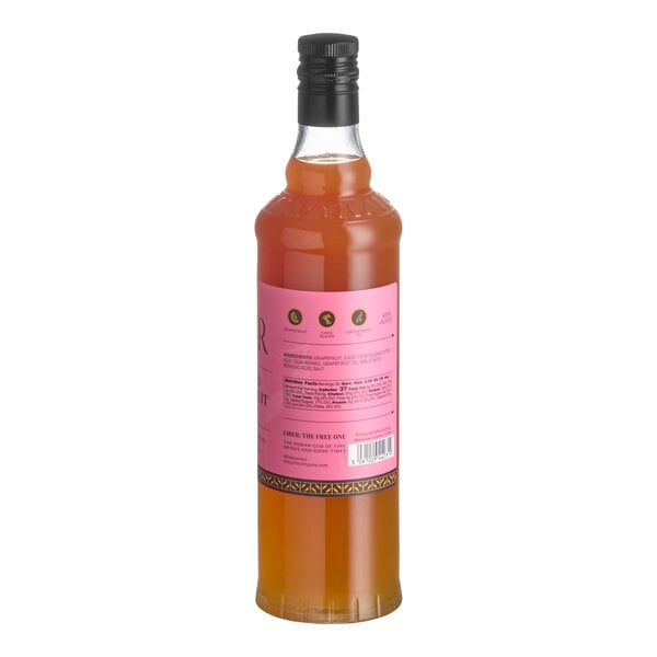 A 750 mL bottle of Liber & Co Rio Red Grapefruit Cordial Syrup with a pink label and black cap.