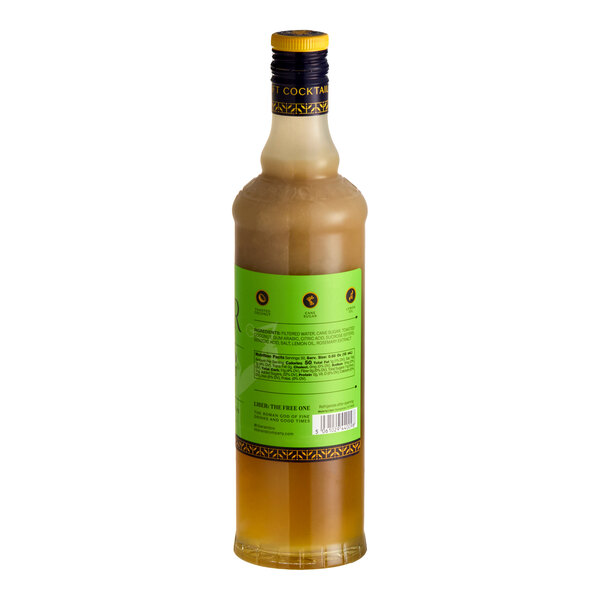A 750 mL bottle of Liber & Co Toasted Coconut Syrup with a green label.