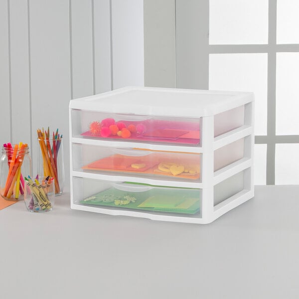 A white three-drawer plastic storage unit designed for countertop organization.