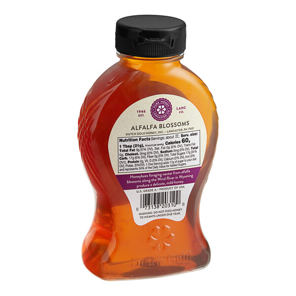 A bottle of Dutch Gold Alfalfa Honey with a label.