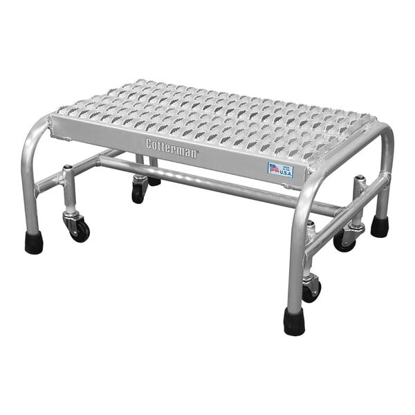 A one-step welded aluminum rolling ladder with a serrated tread and four wheels.