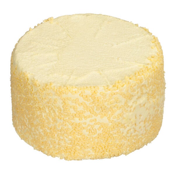 A large round lemon blueberry cake with a smooth top and sides covered in yellow sprinkles.