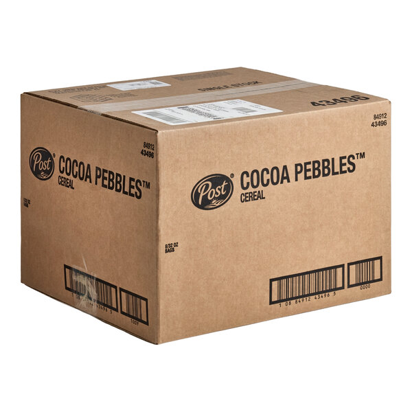A large brown cardboard shipping box labeled 'Post Cocoa Pebbles Cereal' with barcodes and shipping labels visible.