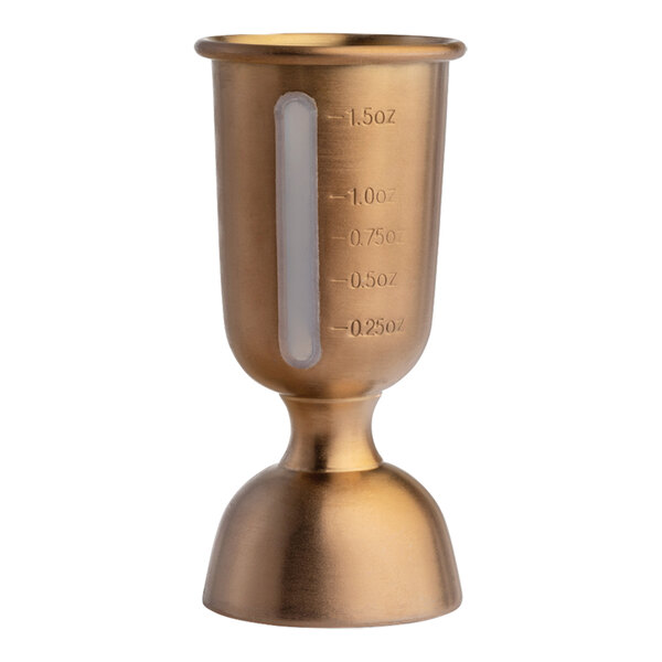 A stainless steel copper bell jigger with a silicone gauge and measurement markings.