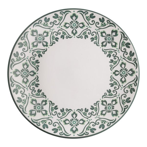 A round stoneware plate with a white center and a decorative forest green floral pattern around the rim.