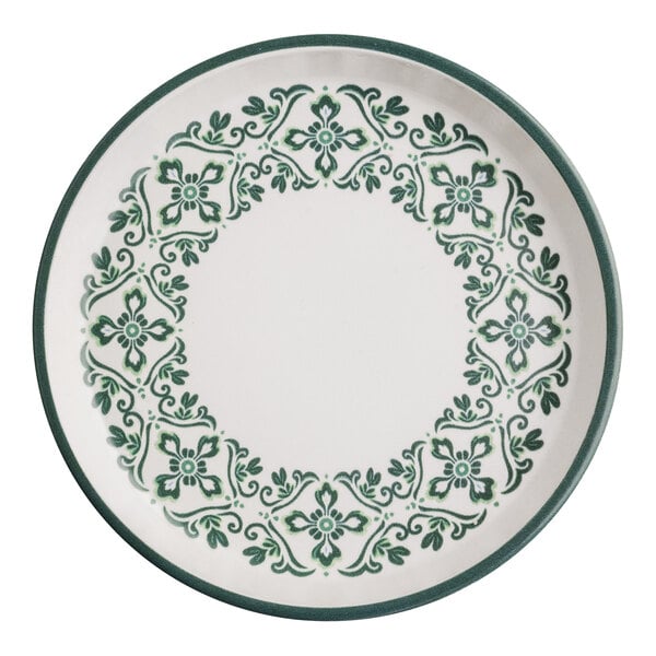 A round stoneware plate with a green floral pattern around the rim.
