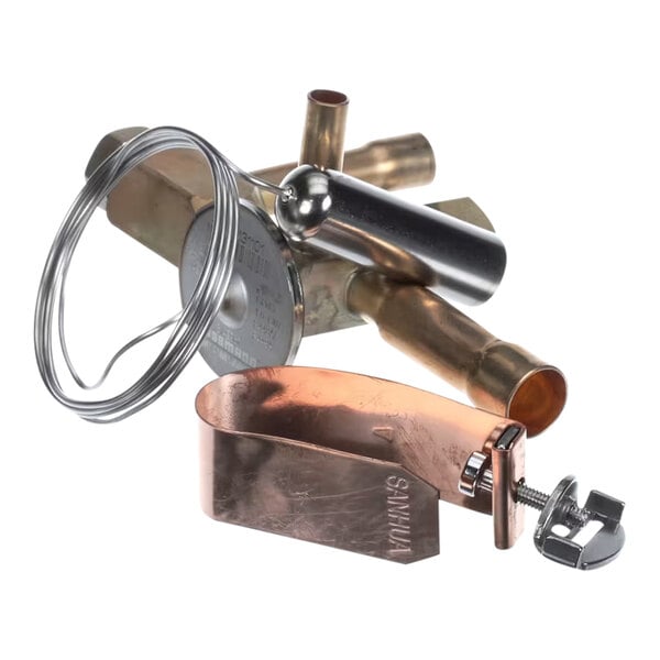 A refrigeration expansion valve assembly with attached copper and metal components.