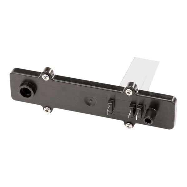 A black plastic reservoir lid with multiple screw holes and connector ports, designed for use with Follett Corporation equipment.