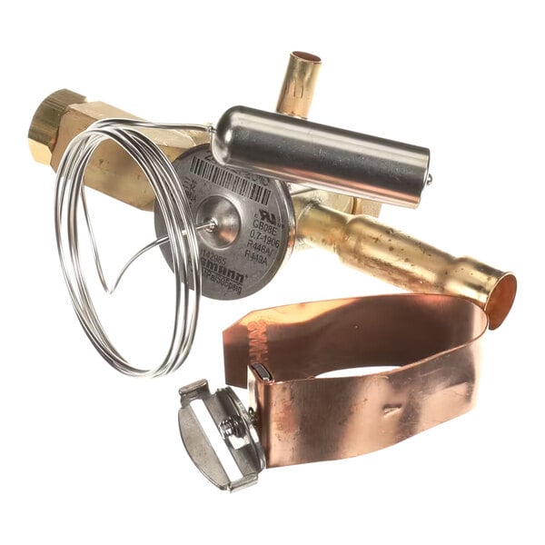 A Hussmann 3142985 TXV valve with attached sensing bulb and copper strap.