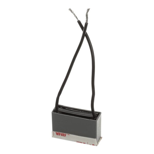 A rectangular capacitor with two black wires extending from the top, used for a rack motor.