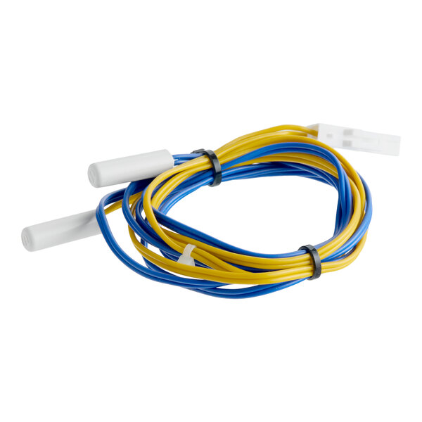 A Turbo Air Refrigeration T8F6200401 sensor with blue and yellow wires and white connectors.