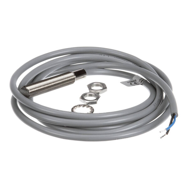 A magnetic proximity switch with a cylindrical metal sensor, attached cable, and mounting hardware.