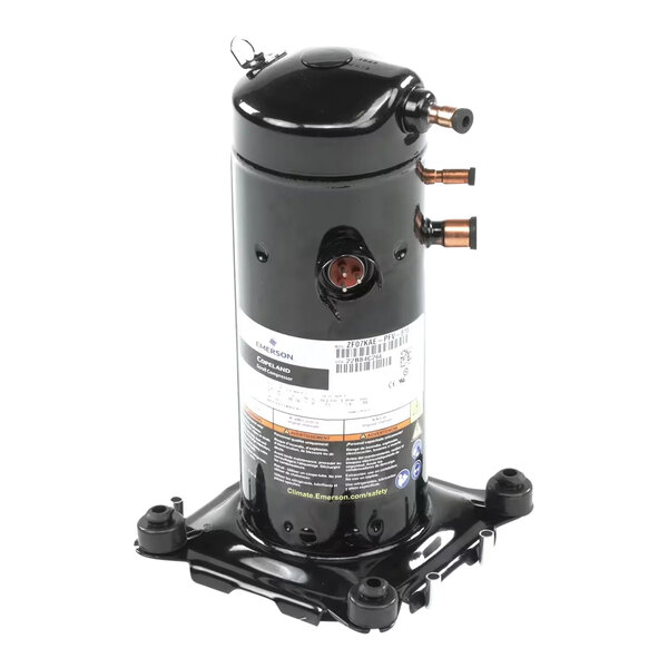 A black cylindrical Copeland compressor unit with copper pipe fittings and a mounting base.
