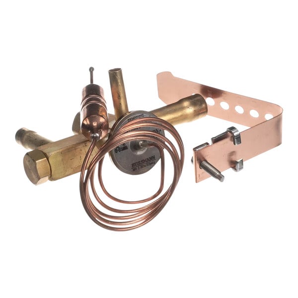 A brass and copper thermostatic expansion valve (TXV) with attached sensing bulb and mounting hardware.