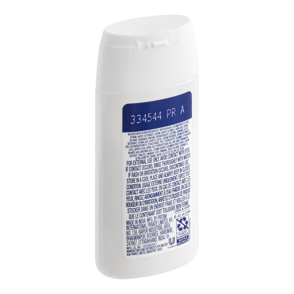 A small white bottle of Dove Cool Moisture Cucumber body wash intended for hotel or motel use.