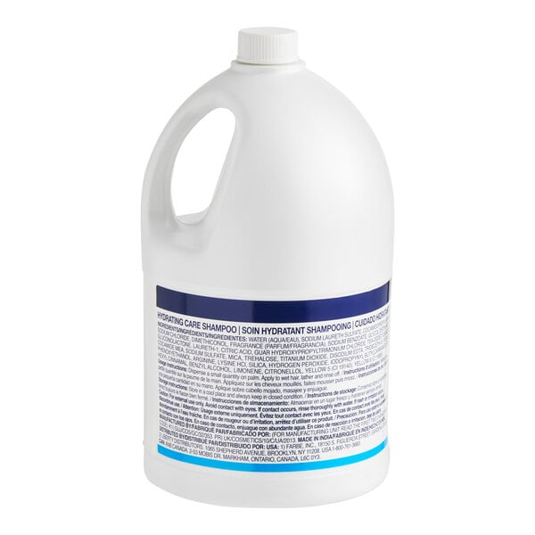 A large white plastic jug of Dove Hydrating Care shampoo with a handle and a blue label.