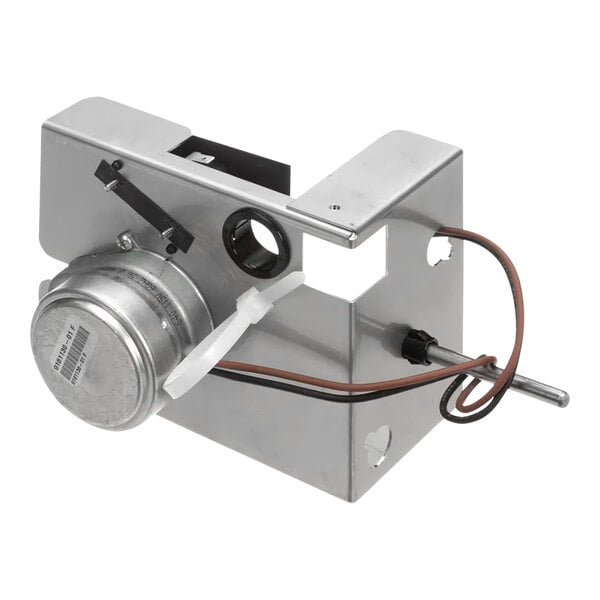 A metal Ice-O-Matic harvest kit with attached wiring and components.