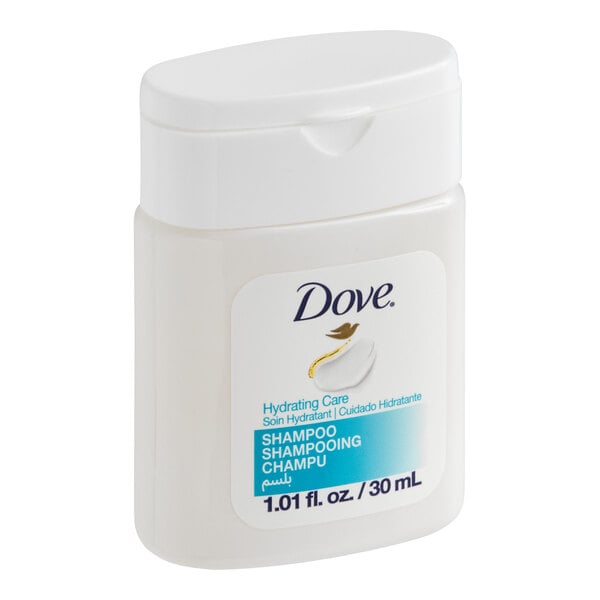 A small bottle of Dove Hydrating Care shampoo labeled for hotel and motel use.
