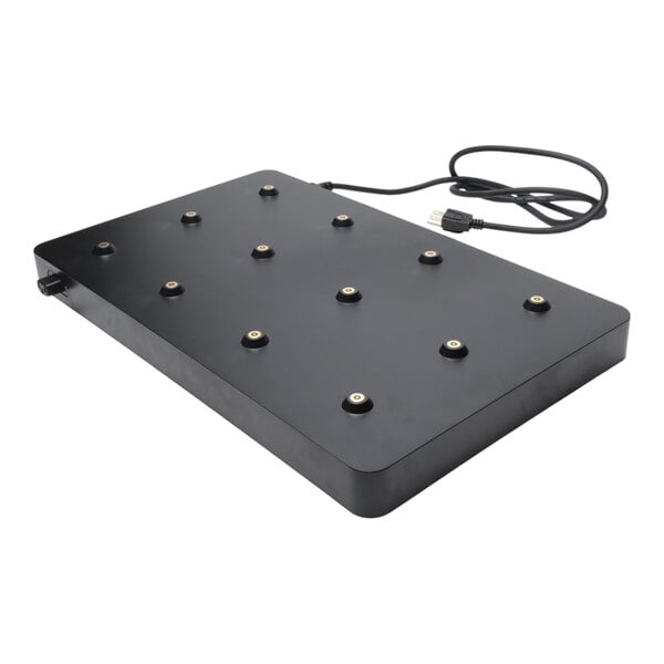 A rectangular black charging carpet with twelve lamp charging points and an attached power cord.