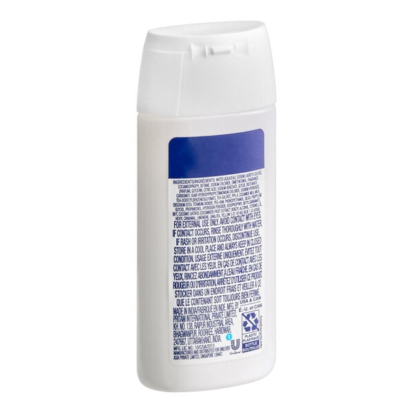 A small white bottle of Dove Cool Moisture Cucumber hotel and motel shampoo.