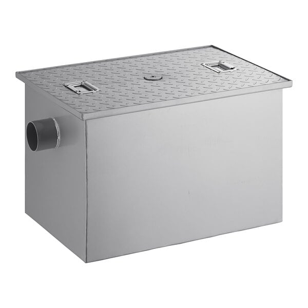 A rectangular metal grease trap with a textured lid and a side pipe connection.